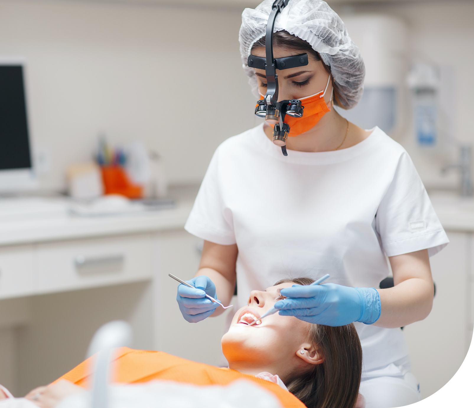 bigstock-doctor-treats-teeth-young-afr-305178229@3x